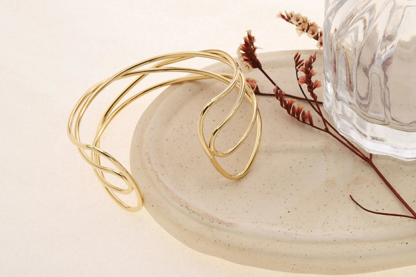 Bracelet manchette dorée ajustable 4 branches entrelacées